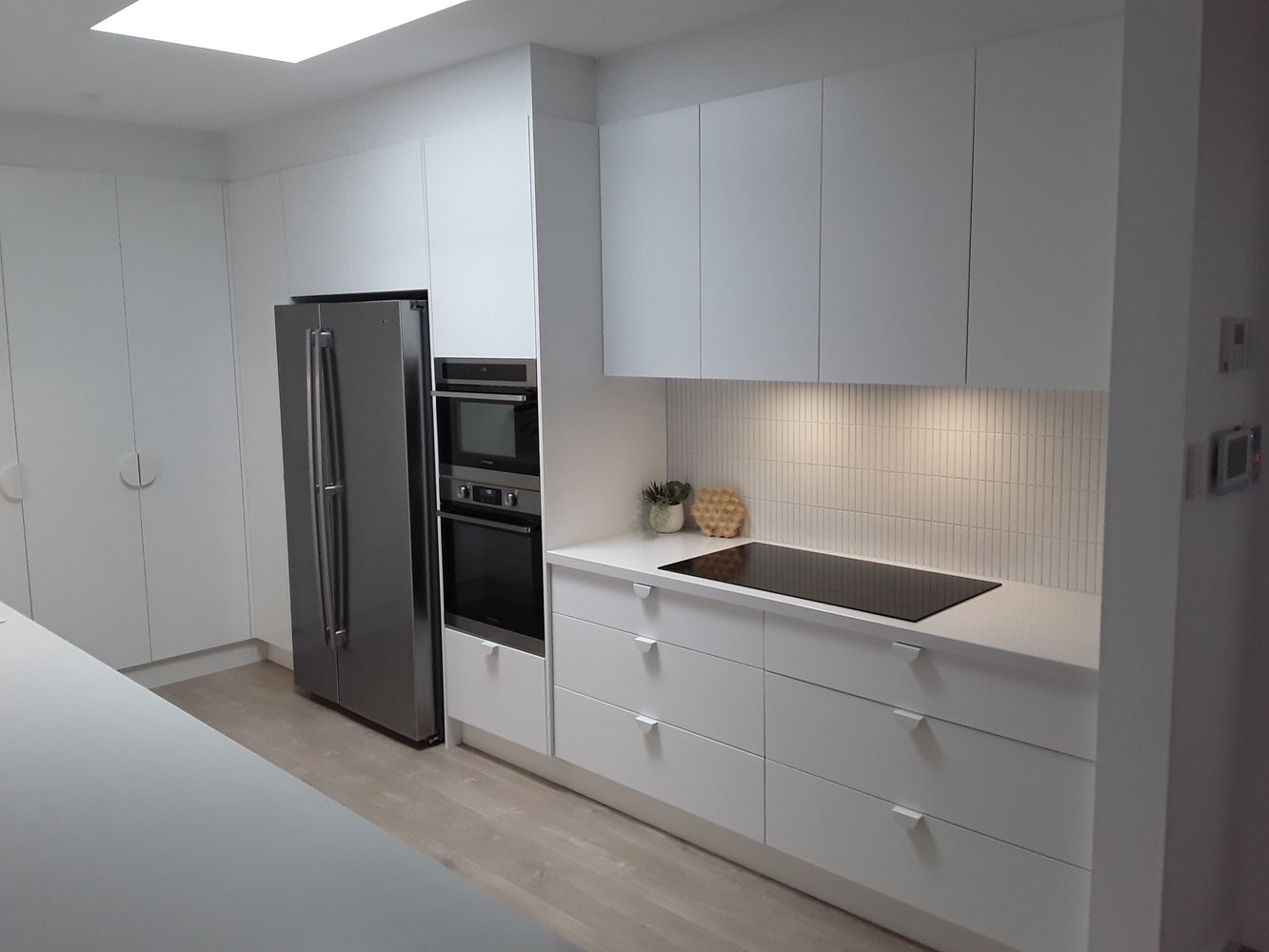 White kitchen cabinetry and appliances